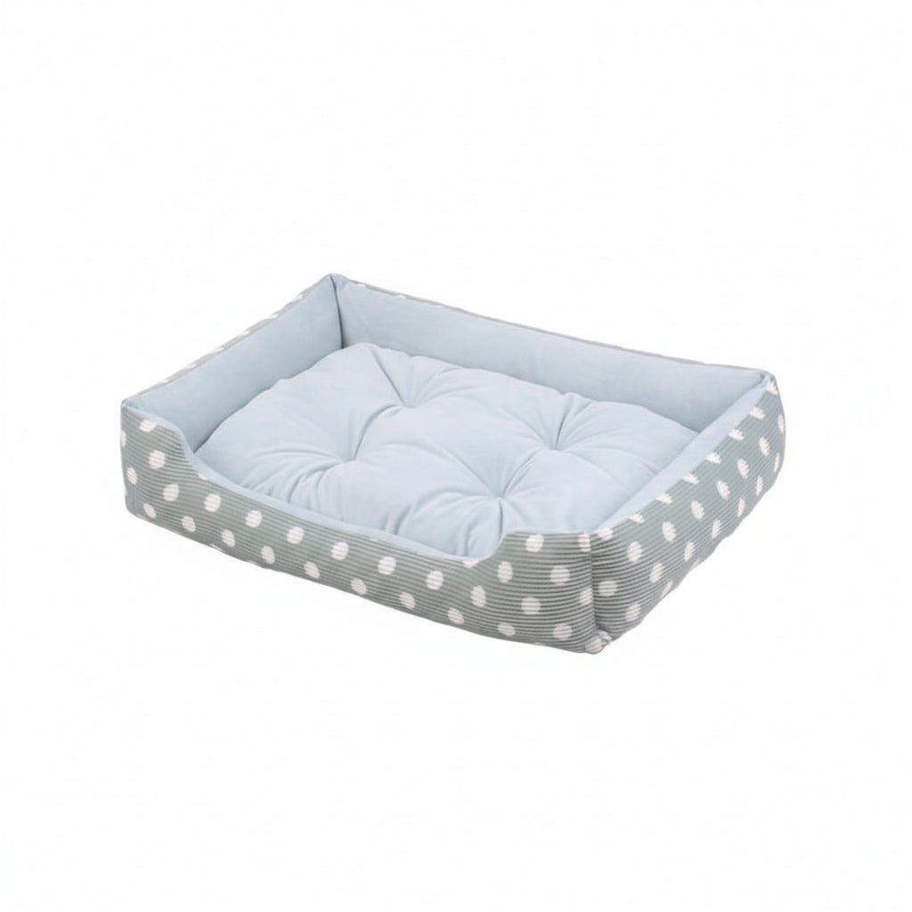 dog bed with a polka dot pattern and a cushion on a white background